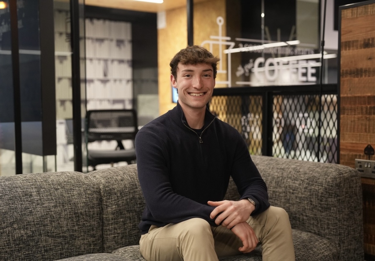 Tom Mason, founder of AwarenessAI, seated and smiling