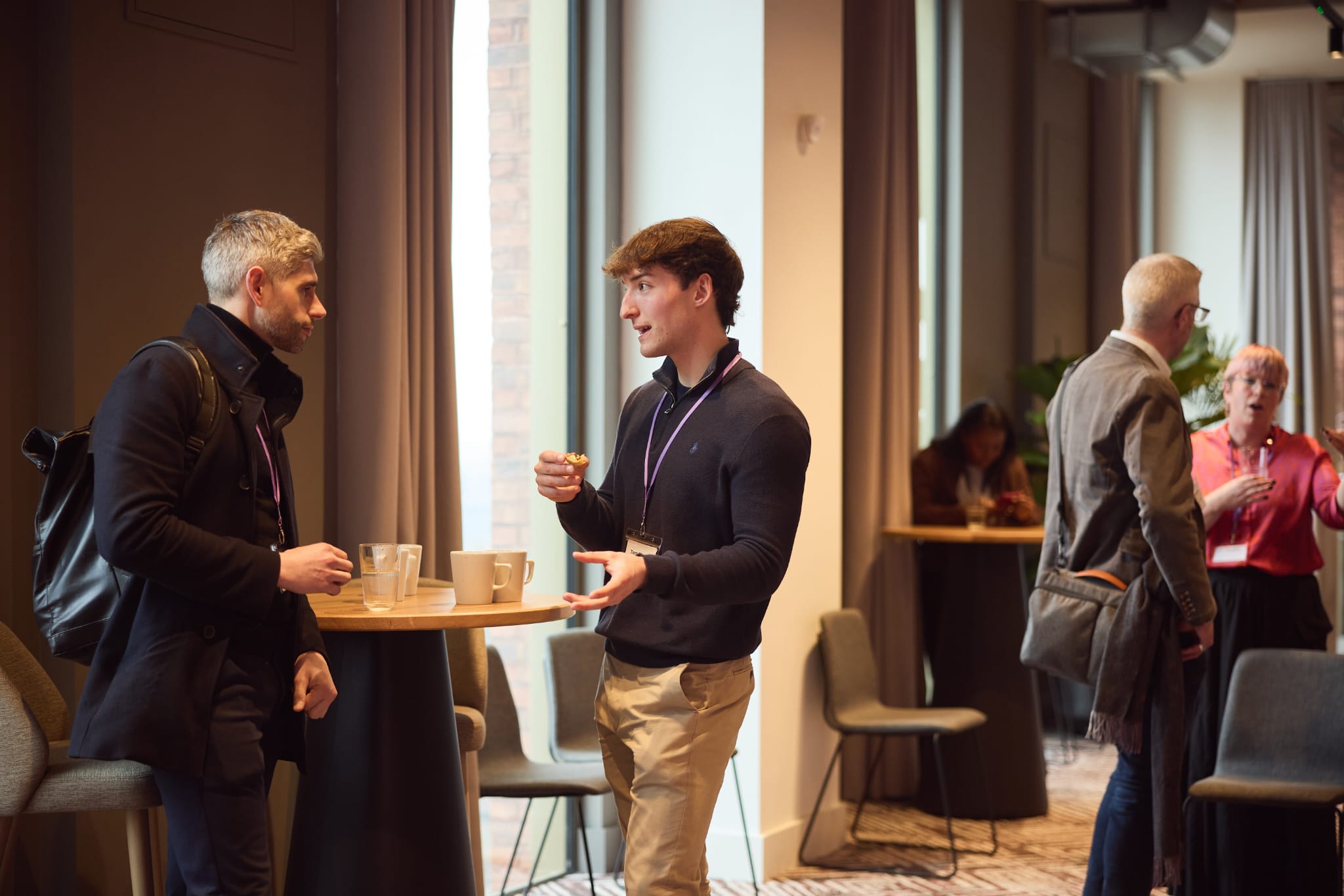 Tom Mason in conversation at a business networking event